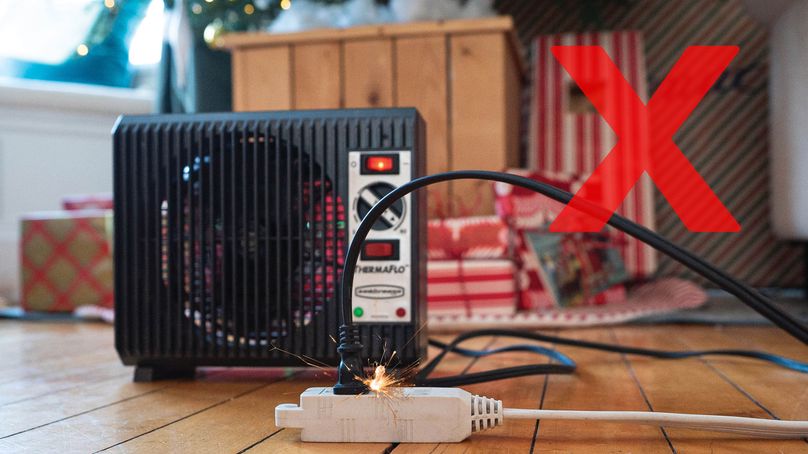 A space heater plugged in to an extension cord causes a spark.