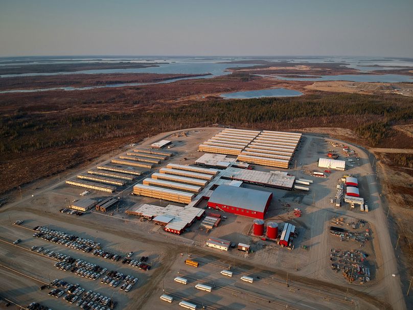 A drone view from overhead showing the camp buildings; including the dorms, the gym, the dining hall/kitchen, and the other facilities – all in one huge, connected structure.